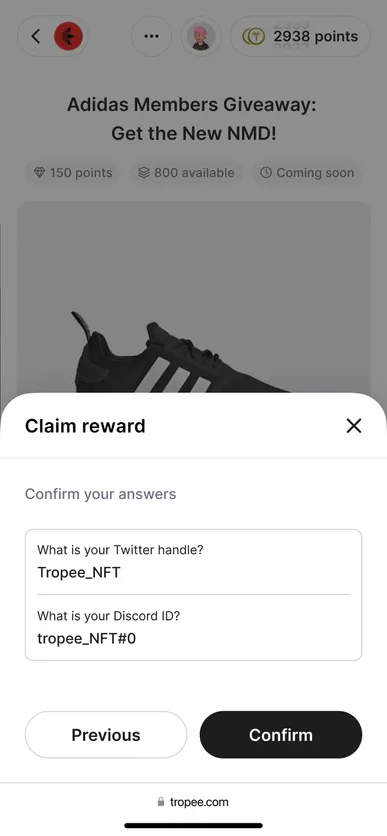 Mobile “Claim reward” sheet asking for a Twitter handle and Discord ID, with Previous and Confirm buttons.